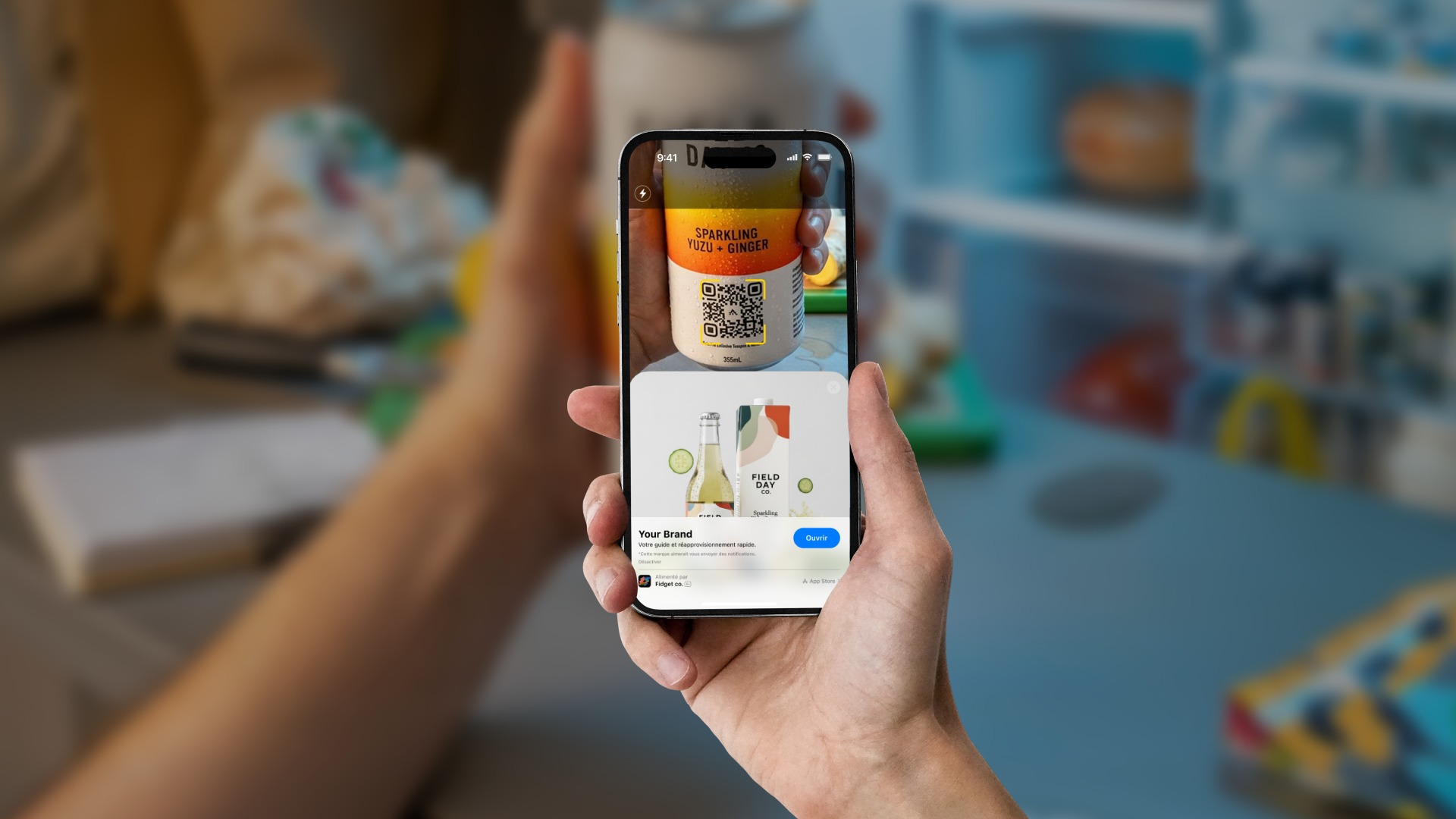 A staffer checks a phone at a bright store counter